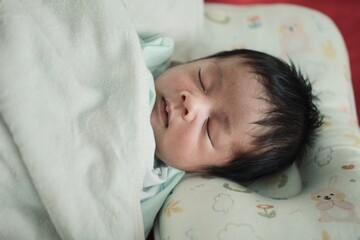 baby sleeping in bed