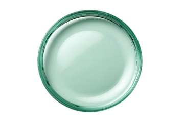 Glass dish filled with pale green, translucent liquid
