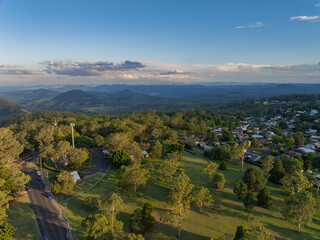 Scenic elevated views of the Australia flag on display at the Picnic Point public park area in Toowoomba with Table Top Mountain and the Bushland Reserve in the background, Queensland, Australia