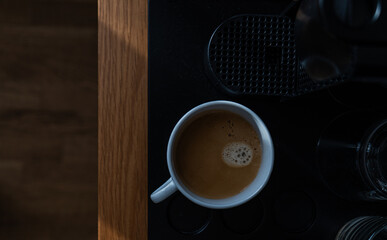 Coffee machine and americano drink in the mug