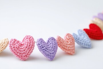 Handmade crochet heart decoration with soft yarn texture, ideal for festive design, greeting cards, and DIY inspiration.