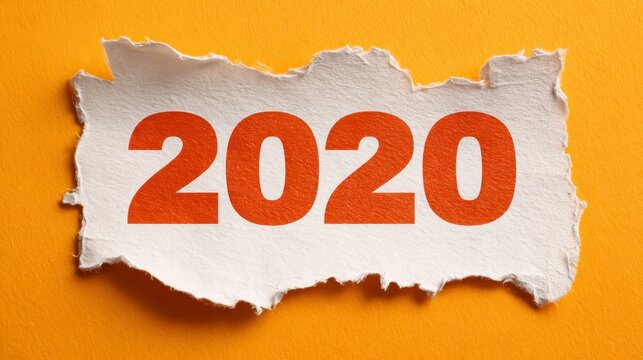 A close-up view presents the year 2020 in bold red numerals on a torn piece of white paper against a bright yellow background - Powered by Adobe