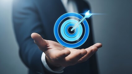 A businessman holds a glowing target icon with an arrow hitting the center