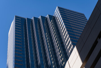 City architecture. Modern glass building. Reflective glass architecture. Architecture in business district. Building architecture. Business building. Glass building. Business city