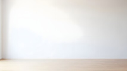 A bright and empty room with white walls and floor