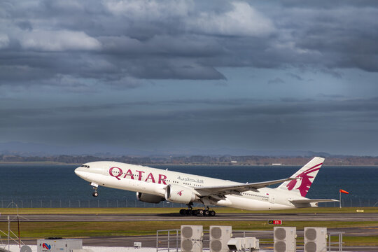 Qatar Airways Boeing 777-2DZ(LR) taking off from Auckland Airport, New Zealand on long range flight to Doha, one of the world's longest commercial flight routes. On July 28, 2025.