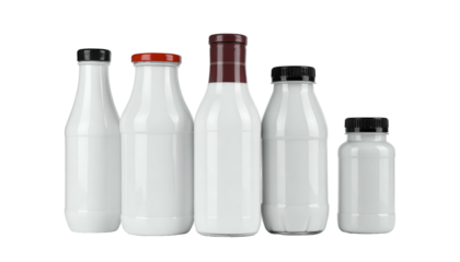 Five white opaque glass bottles, varying in size and cap color. They are arranged closely together against a dark background, suggesting products
