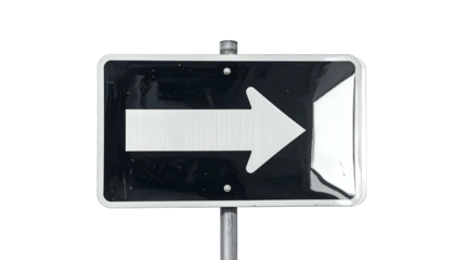 Black, rectangular street sign shows a white arrow pointing right. Isolated on a black background