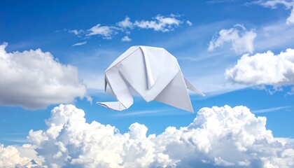 Origami Elephant Floating Gracefully Amidst Fluffy White Clouds in a Vibrant Blue Sky.