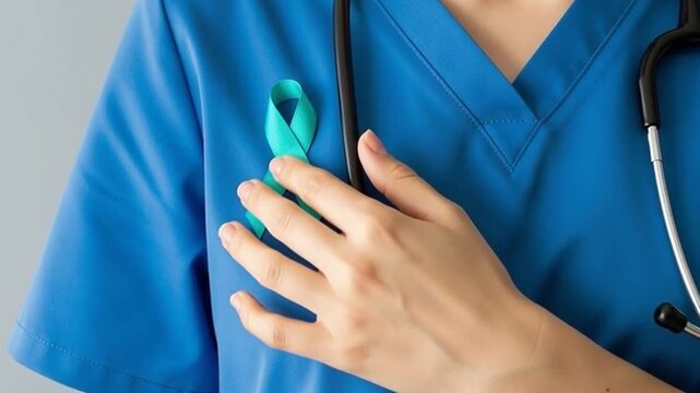 Healthcare professional showing teal ribbon awareness.