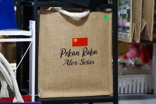 Kedah, Malaysia, December 5, 2025: Local Malaysian Tote Bags and Souvenirs Displayed at Pekan Rabu Market