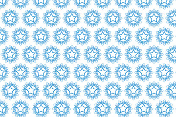 Intricate blue and white pattern with symmetrical floral motifs © sumana