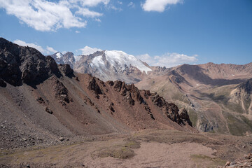 High altitude mountain landscape in August. Majestic peaks and glaciers of Trans-Ili Alatau at 3000 meters above sea level, Almaty, Kazakhstan.