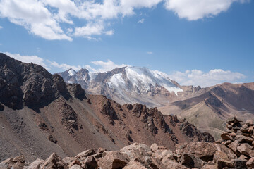 High altitude mountain landscape in August. Majestic peaks and glaciers of Trans-Ili Alatau at 3000 meters above sea level, Almaty, Kazakhstan.