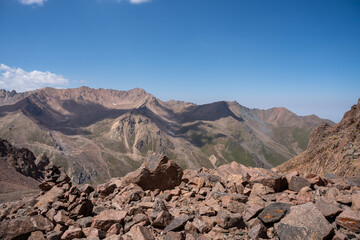 High altitude mountain landscape in August. Majestic peaks and glaciers of Trans-Ili Alatau at 3000 meters above sea level, Almaty, Kazakhstan.