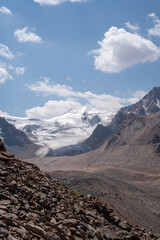 High altitude mountain landscape in August. Majestic peaks and glaciers of Trans-Ili Alatau at 3000 meters above sea level, Almaty, Kazakhstan.