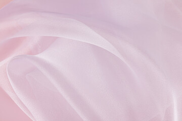 white waves, vortices of airy light fabric. wedding background. light airy organza silk. shine and shine of the fabric. wedding background