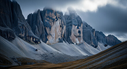 The rugged Patagonian Desert, with jagged rock formations standing starkly against the soft hues of a cloudy sky