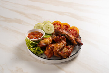 Ayam Goreng Lengkuas Kremes or Galangal Fried Chicken, One of Indonesia's culinary icons. Perfect for recipes, articles or any cooking content.