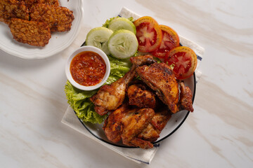 Ayam Goreng Lengkuas Kremes or Galangal Fried Chicken, One of Indonesia's culinary icons. Perfect for recipes, articles or any cooking content.