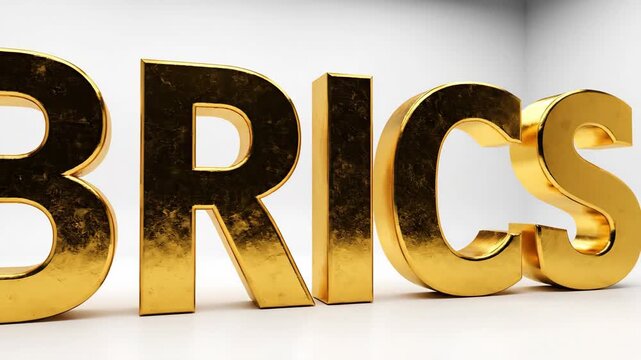 Large, golden 3D text "BRICS" rendered in front of a white backdrop, angled perspective