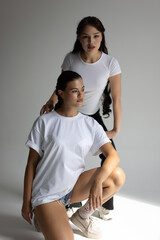 Energetic Photoshoot Capturing Models In Casual Athletic Outfits With Natural Lighting And Lively Stance