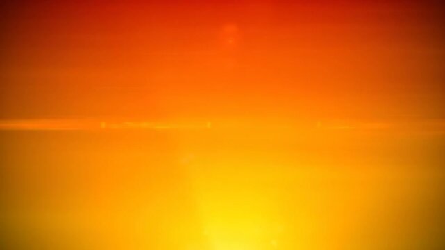 Abstract fiery orange and red gradient background with shimmering horizontal light flare and particles for design