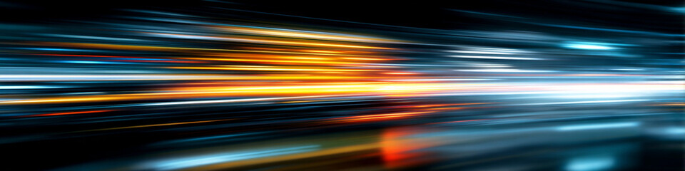 A vibrant abstract background with colorful streaks of light moving rapidly across a darkened space