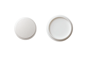 Two white round container lids, one textured, one smooth
