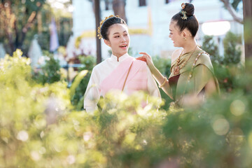 Cultural exchange women laughing together in garden