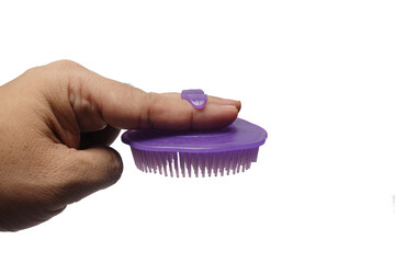 A hair comb that is used by tucking it between your fingers.isolated on white background