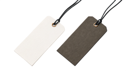 Two blank price tags on black cords against black background