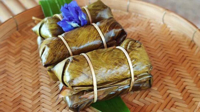 Khao Tom Mud, Traditional Thai dessert sticky rice, coconut milk and banana wrapped in banana leaves