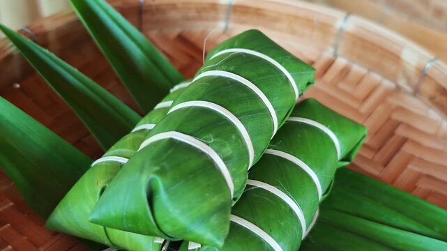 Khao Tom Mud before cooking,Traditional Thai dessert sticky rice, coconut milk and banana wrapped in banana leaves