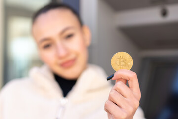 Young moroccan girl  at outdoors using an ATM
