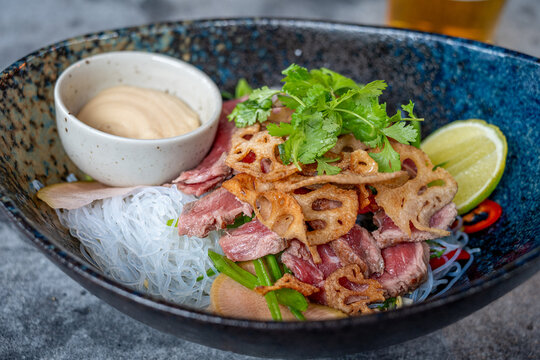 Beef Sashimi with glass noodles served as a starter 