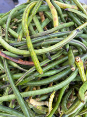 pile of yard long beans in natural daylight