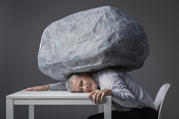 A Businessman Crushed by the Heavy Weight of Daily Responsibilities