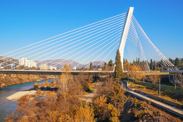 Montenegro, Podgorica city. View of Millennium Bridge,  cable-stayed bridge over Moraca River on sunny autumn day