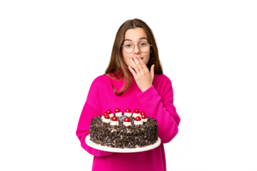 Teenager girl holding birthday cake over isolated chroma key background happy and smiling covering mouth with hand