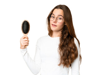 Teenager girl with hair comb over isolated chroma key background smiling a lot