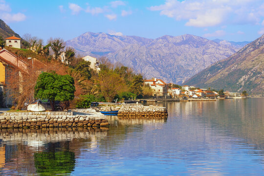 Beautiful spring Mediterranean landscape. Montenegro, Adriatic Sea. View of coast of Kotor Bay and Prcanj town on sunny March day