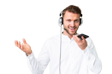 Telemarketer caucasian man working with a headset over isolated chroma key background keeping a conversation with the mobile phone with someone