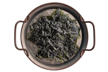 Nori seaweed sheets on a plate isolated on white background. top view