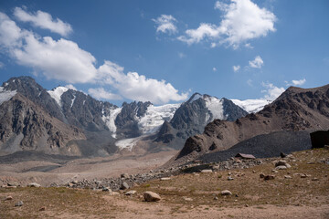 Panoramic view of the Tien Shan mountain range on the border of Kazakhstan and Kyrgyzstan. Central Asian high-altitude wilderness.