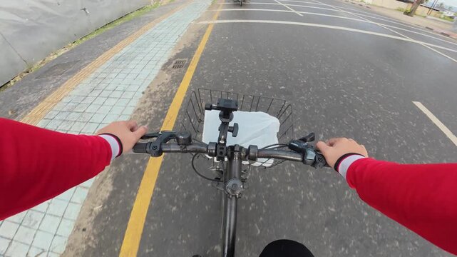 First-Person View of Riding Bicycle on Street