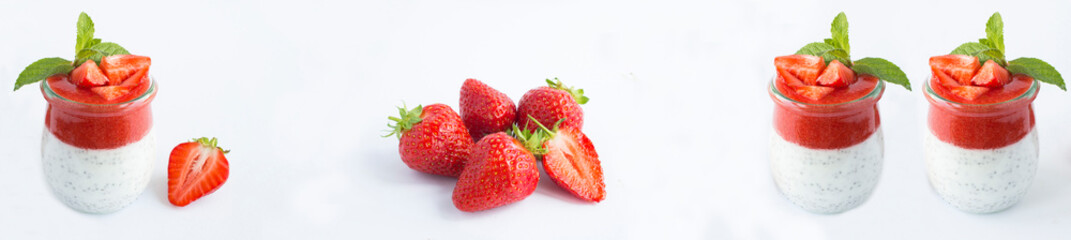 Pudding with chia seeds in the glass jars and strawberry on a white background. Close-up
