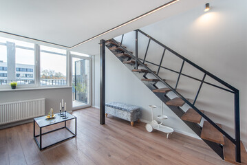 Modern Home Loft Interior Living Space Featuring Stylish Staircase and Minimalist Design
