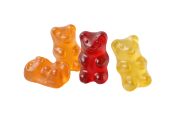 Four colorful gummy bears in red, yellow, and orange