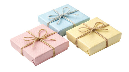 Obraz premium Three small pastel colored jewelry gift boxes tied with rustic twine bows arranged together on transparent background